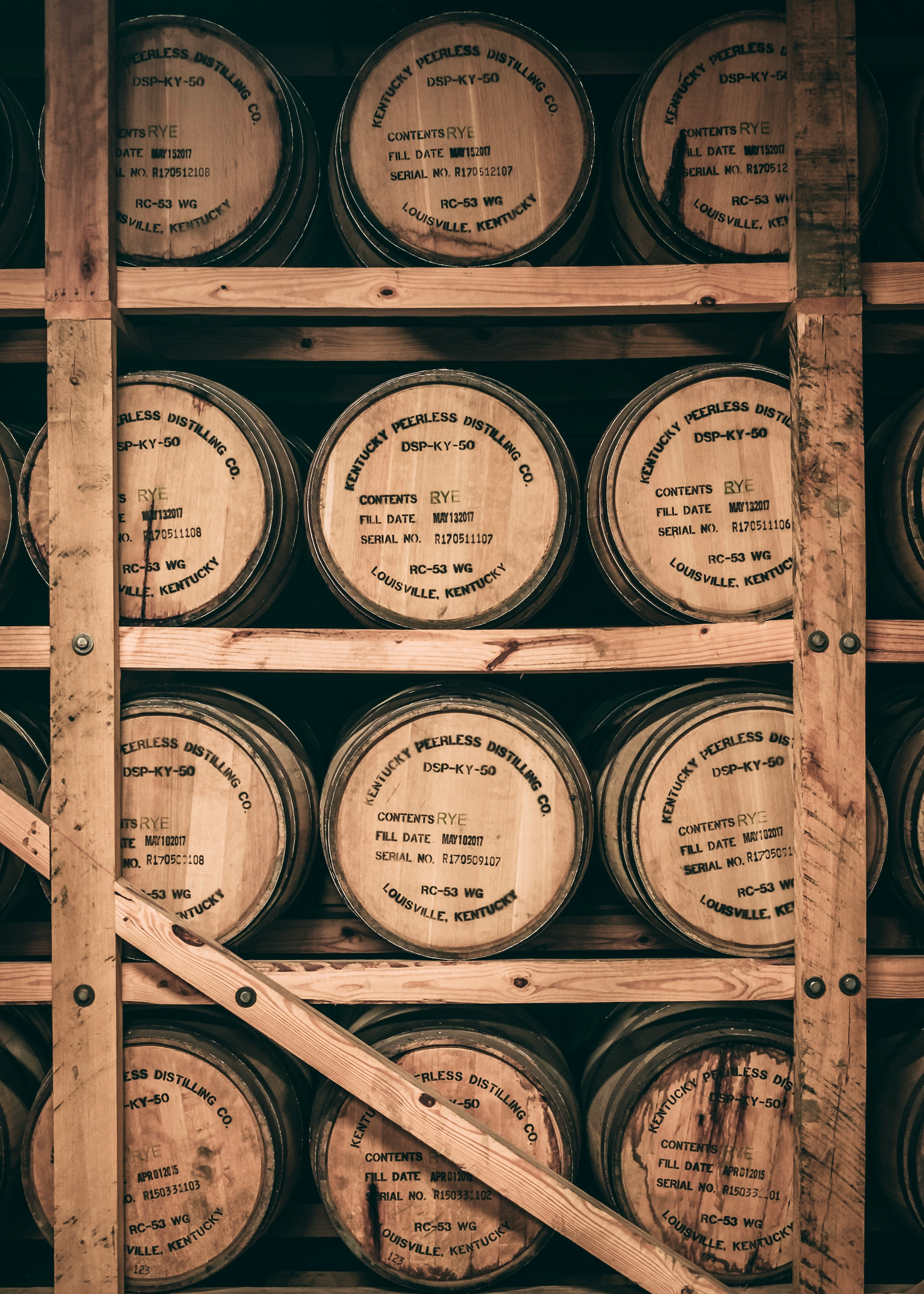 Stacked bourbon barrels in traditional rickhouse